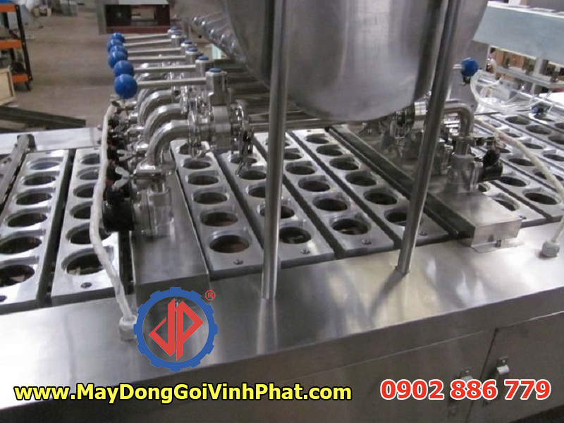 Cấu tạo dây chuyền máy chiết rót dán miệng hộp sữa chua Vĩnh Phát